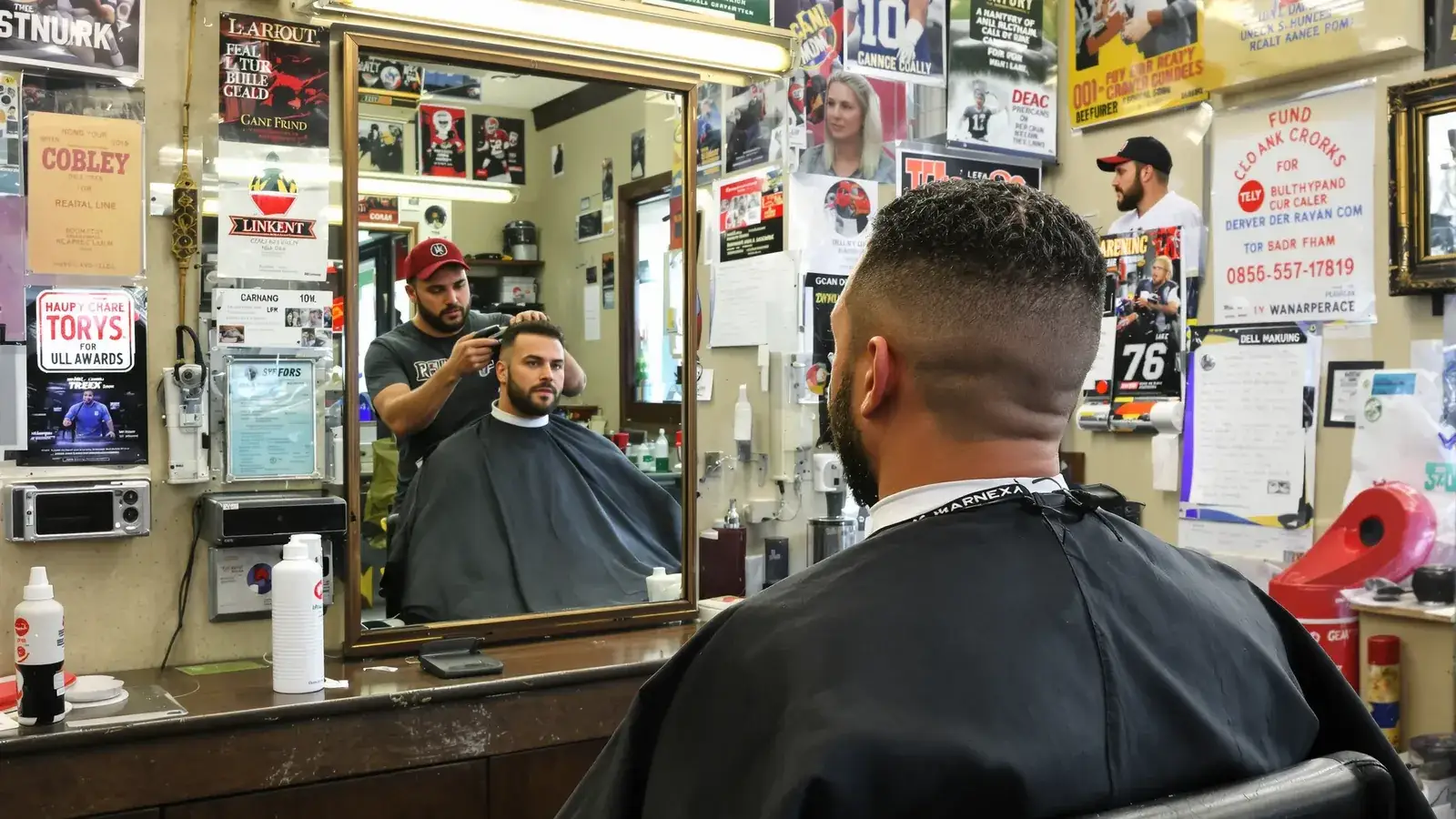 Man getting a haircut shows natural hair transplant results.